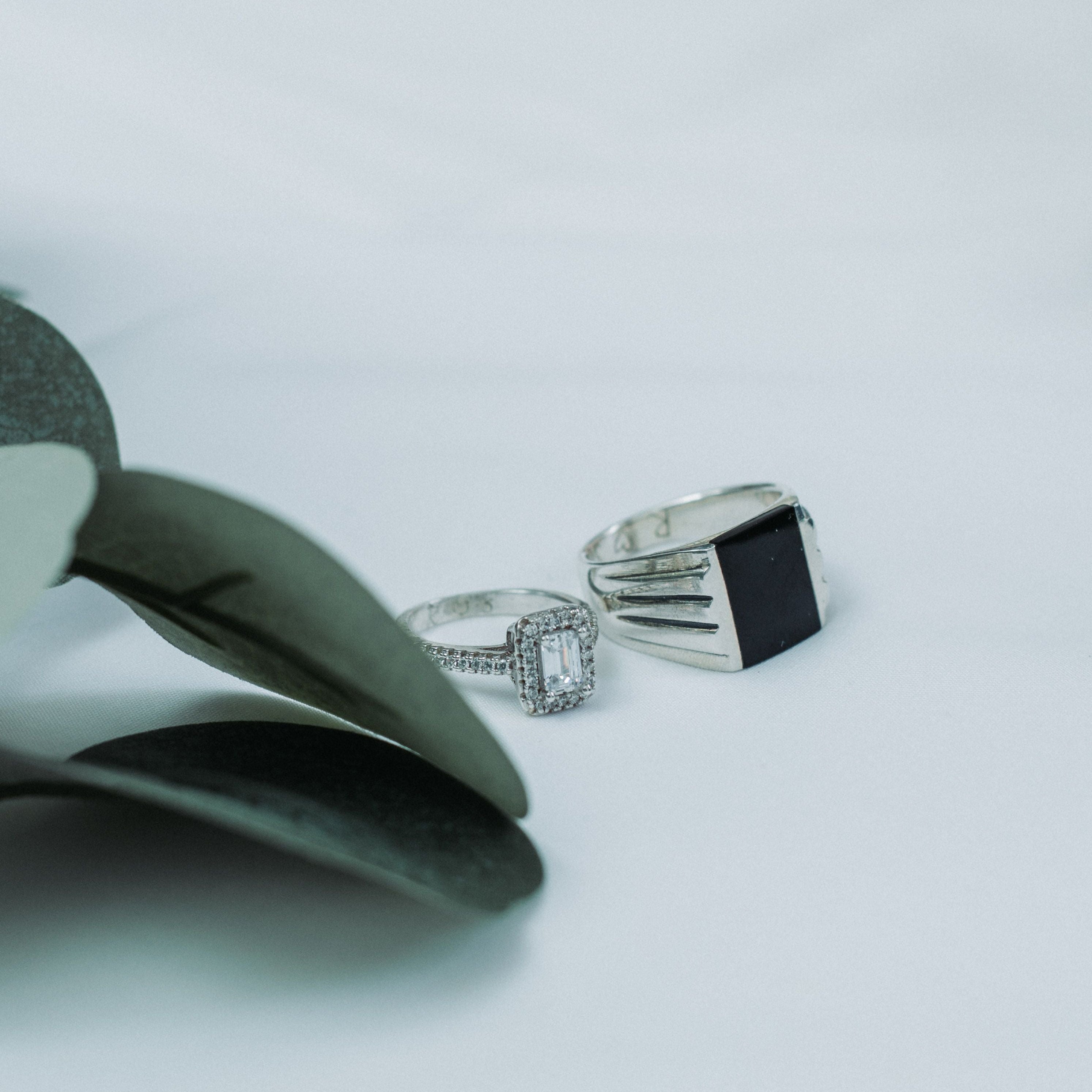 Two silver rings with a pair of pliers, couple rings
